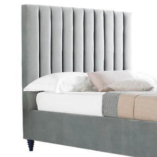 Bed with velvet upholstered headboard