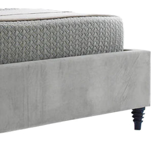 Bed with velvet upholstered headboard